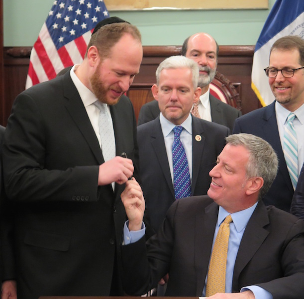 City Councilman David Greenfield, left, with Mayor Bill de Blasio, seated.