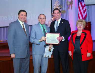 Council member Mark Treyger presents a certificate to his colleague Chaim Deutsch (1)