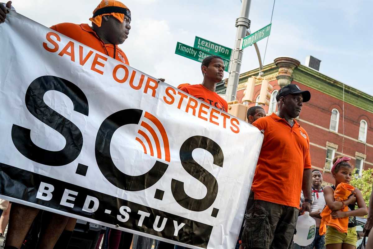 Community residents, faith leaders, Cure Violence organizations, and elected officials joined the Peace March in Bed-Stuy to close out Gun Violence Awareness Month. (Photo by Tsubasa Berg)