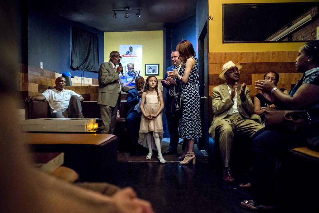 Rev. Leroy Gripper Jr. gives a prayer for Detective Robert Lynch, his wife and daughter. (Photo by Tsubasa Berg)