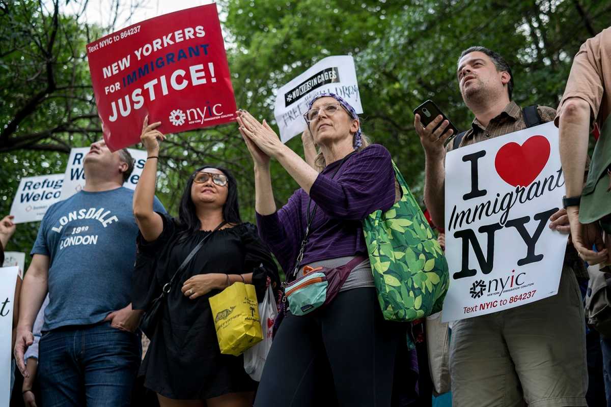 Hundreds of protesters chanted in unison towards the building across the street where Senator Chuck Schumer resides. (Photo by Tsubasa Berg)