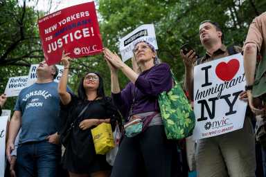 Hundreds of protesters chanted in unison towards the building across the street where Senator Chuck Schumer resides. (Photo by Tsubasa Berg)