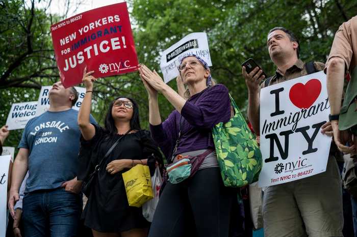 Hundreds of protesters chanted in unison towards the building across the street where Senator Chuck Schumer resides. (Photo by Tsubasa Berg)