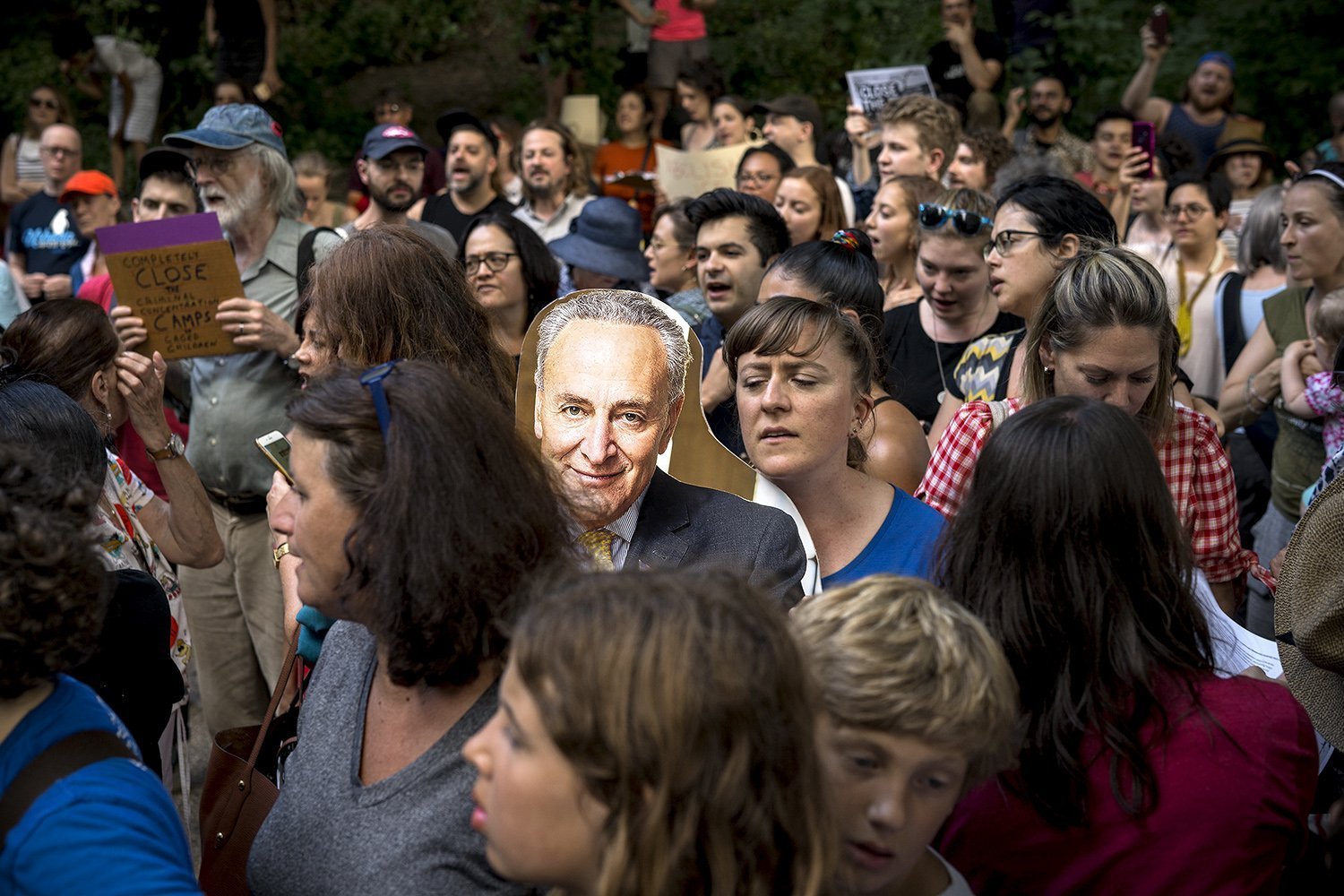 Protesters fill the street across Senator Chuck Schumer's Brooklyn residence on Prospect Park West (Photo by Tsubasa Berg).