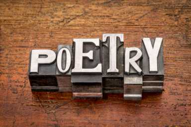 poetry word in metal type