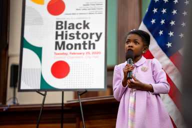 Cydnee Buggs singing the Star-Spangled Banner to start off the event. Photo by Tsubasa Berg