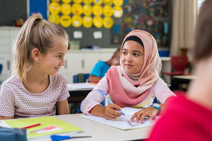 Muslim girl with her classmate