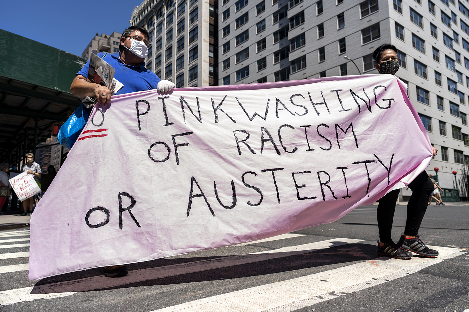 Co-founder of Fight for NYCHA Louis Flores (right) lead the March with a community activist Marni Halasa. (Photo by Tsubasa Berg)
