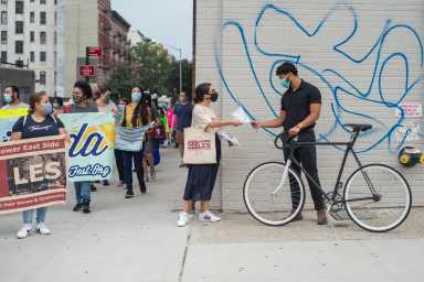 Marielle Martiney (Center), Senior Impact Manager of Good Old Lower East Side, a neighborhood housing and preservation organization at the march