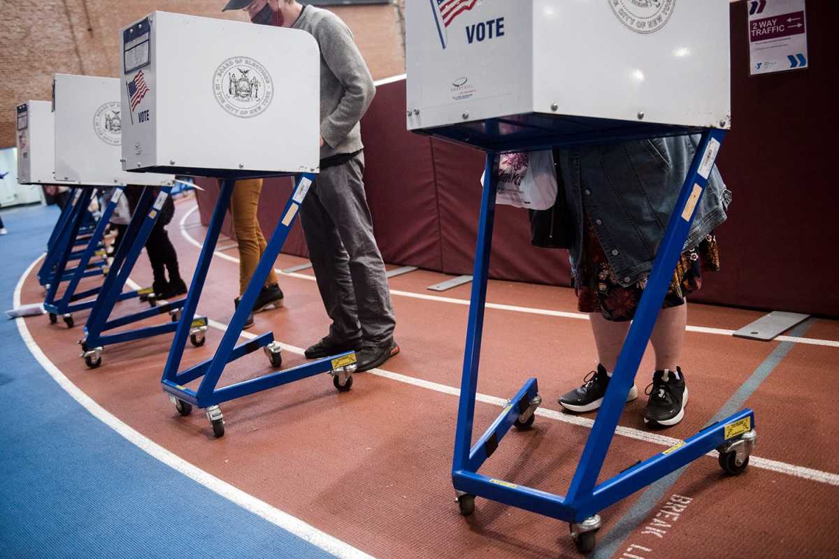 Voters voting in booths