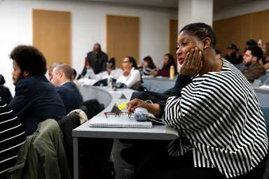 A hundred of Community Board members joined the session, including Tina Smith (Right), a local attorney.