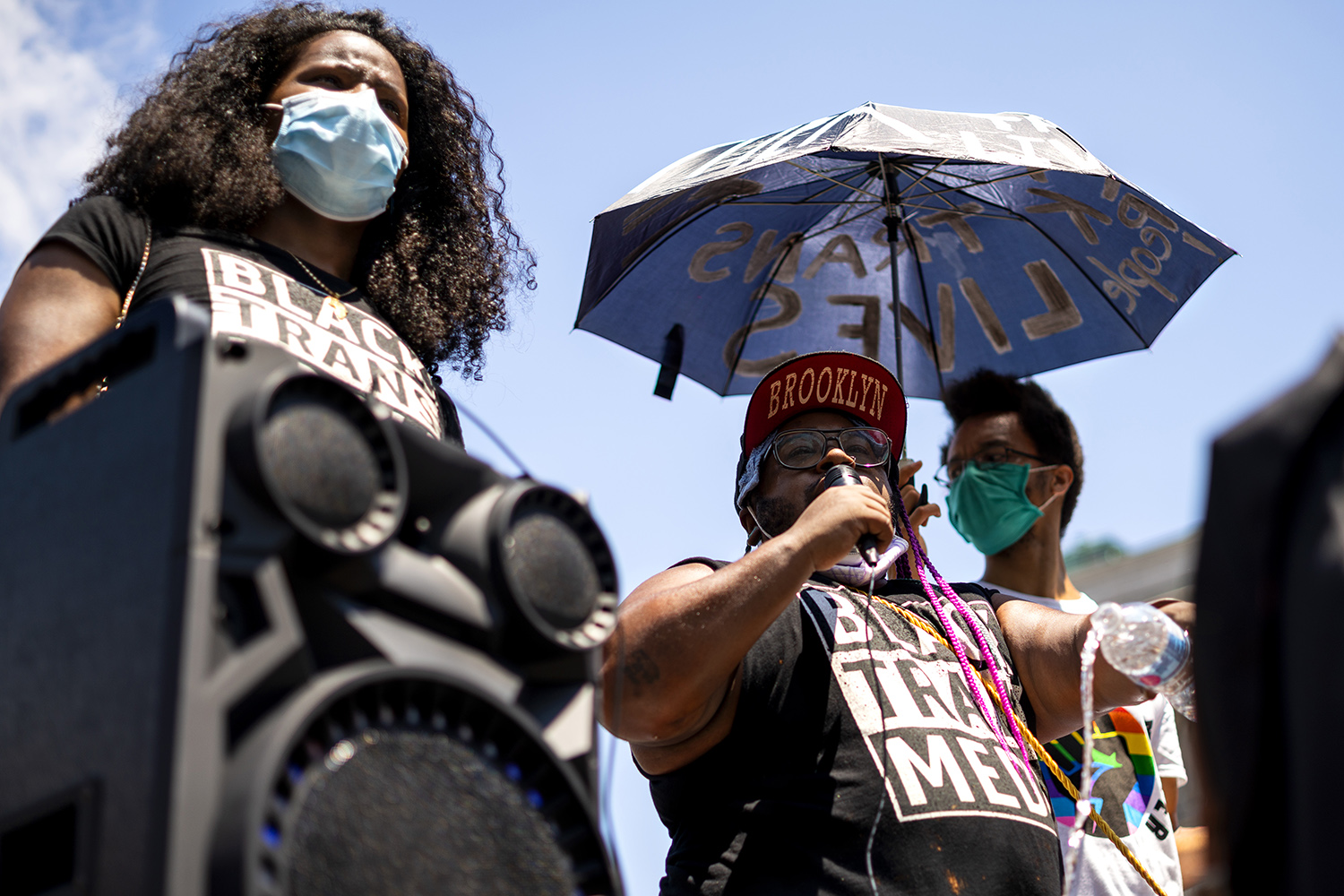Olympia Perez (left) and Sasha Alexander (right) of Black Trans Media, pouring one out for their black brothers and sisters (Photo by Tsubasa Berg)