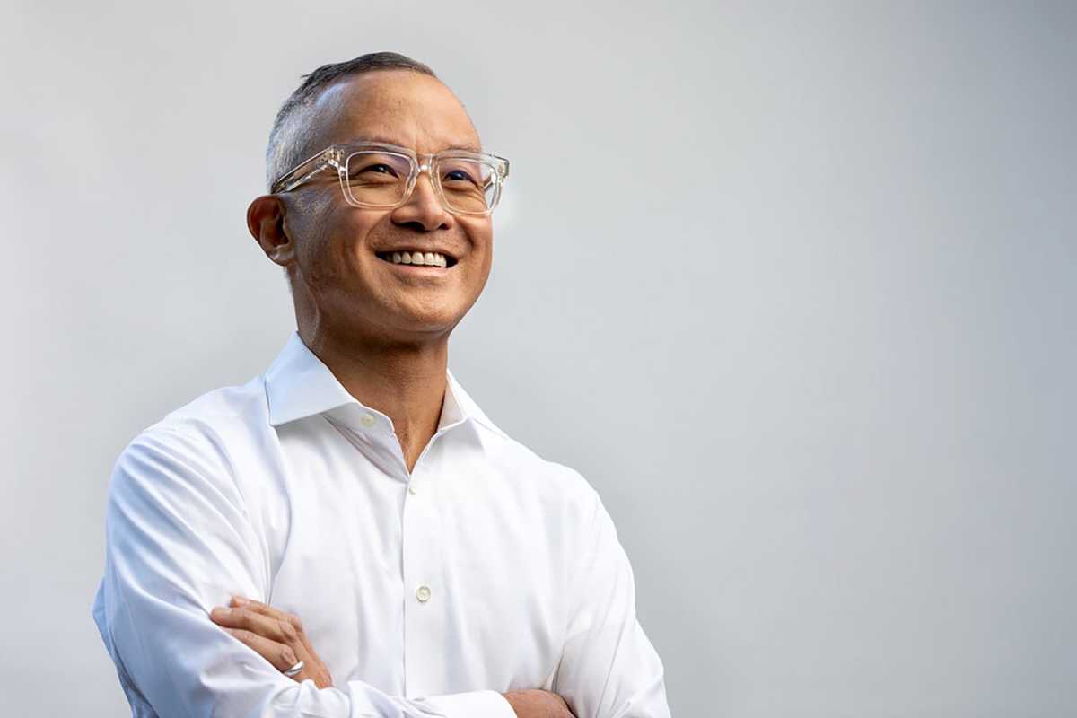 Art Chang with his arms crossed and smiling off camera angle