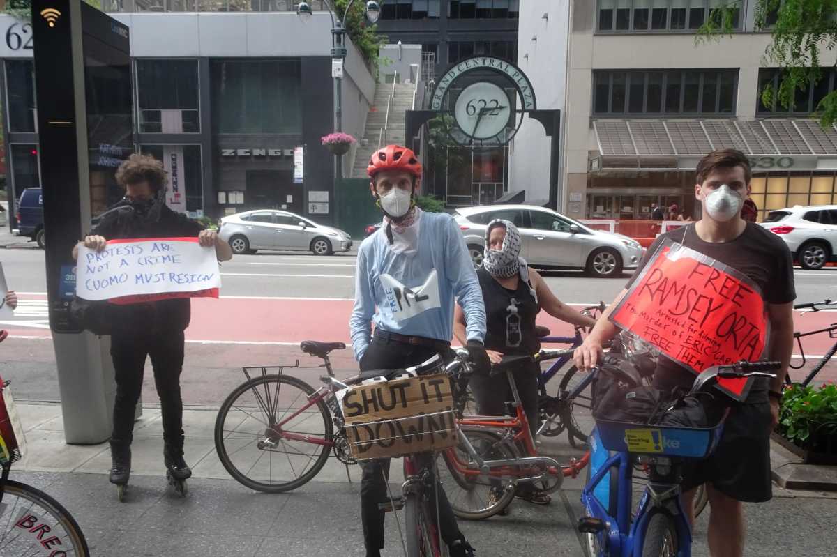 RUF and BSS protesters stand together, ready to begin their bike caravan [photo by William Engel]